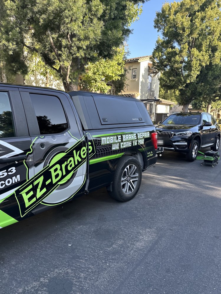 Black BMW X3 during mobile brake service in Irvine