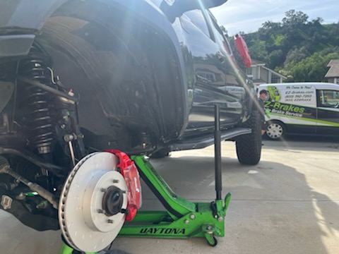 Brake rotor and caliper service with the EZ-Brakes van in the background